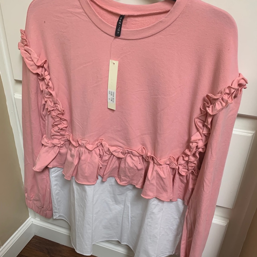 Pink and white ruffled shirt